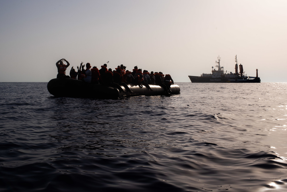 Sea-Watch 4, Mission 1; Rescue 2, 23.08.2020 / Chris Grodotzki / Sea-Watch.org At the first light on August 23, the Sea-Watch 4 morning look out spotted a small black vessel in international waters, some 31 nautical miles from the coast of Libya. The overcrowded and unseaworthy rubber boat carried 60 men and women, as well as 9